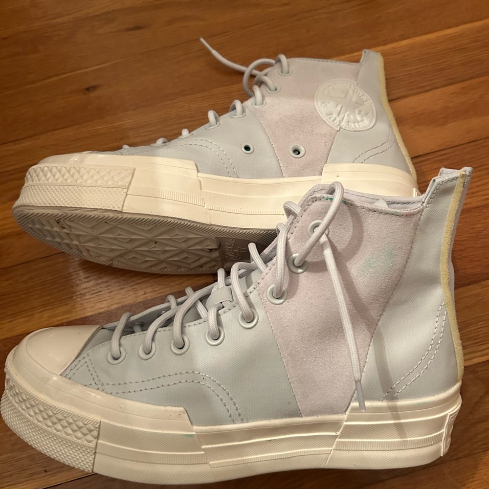 Converse High-Top Sneakers in baby blue and white.